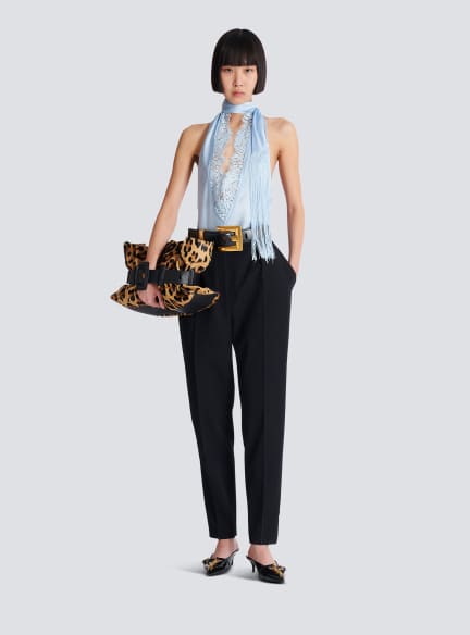 Backless fringed satin top