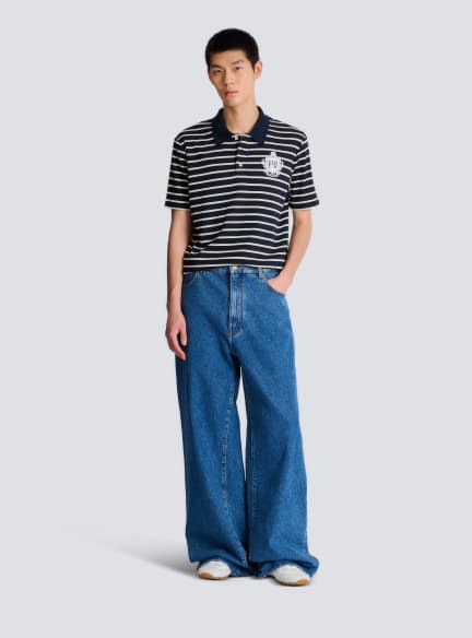 Gestreiftes Poloshirt mit College-Emblem