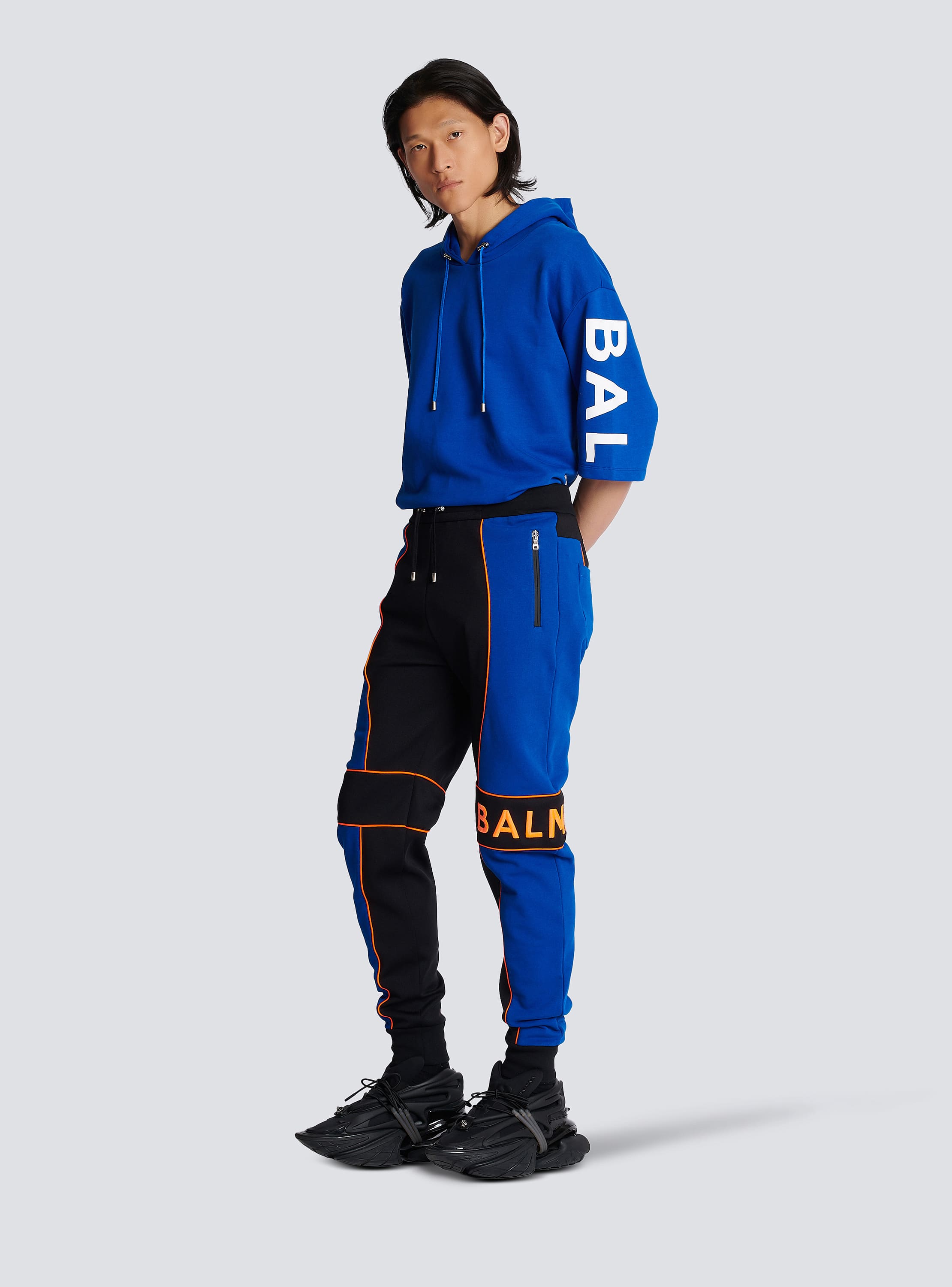 Jogging bottoms with Balmain logo inserts - Men | BALMAIN