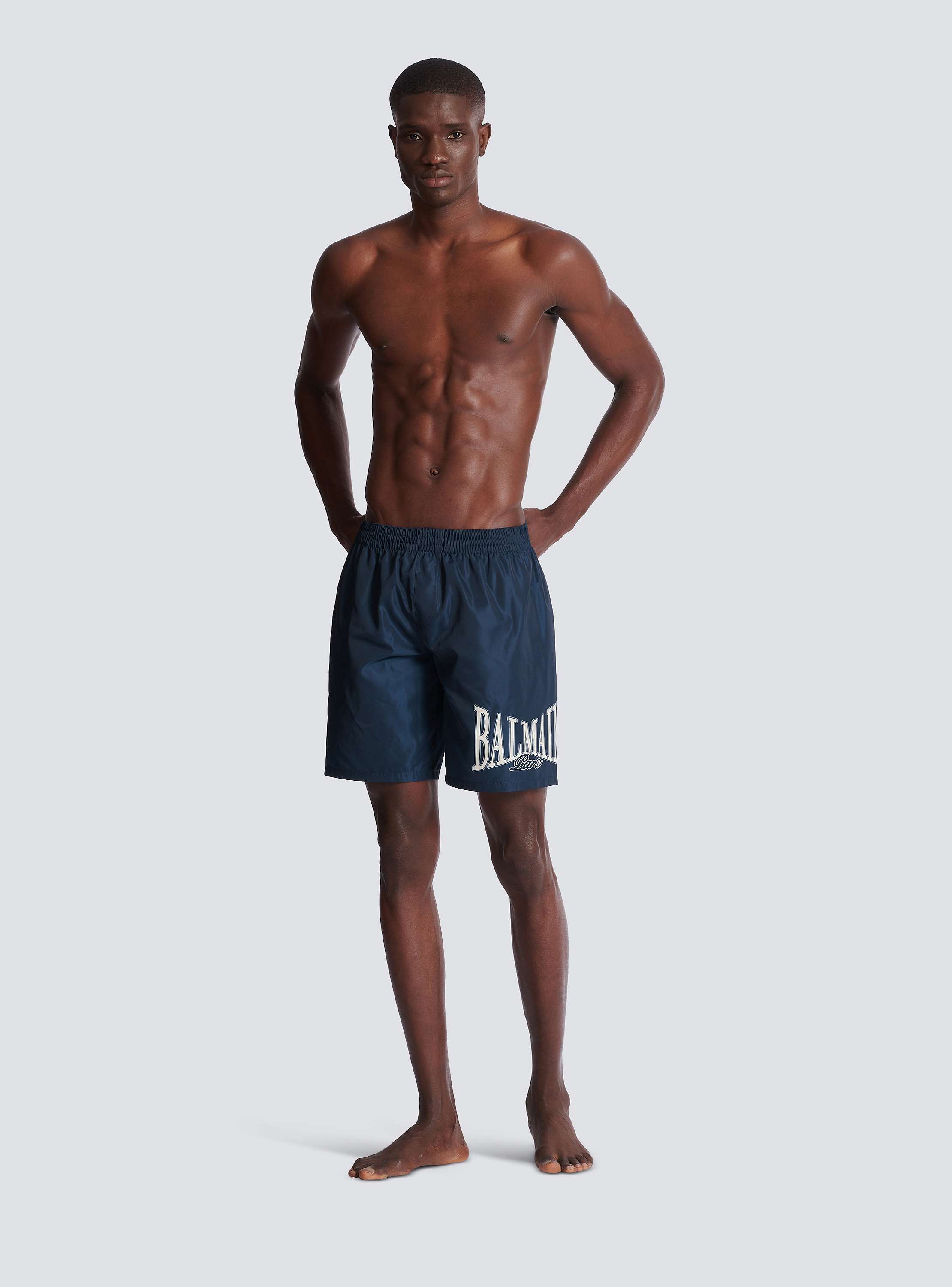 Swim shorts with Balmain College logo