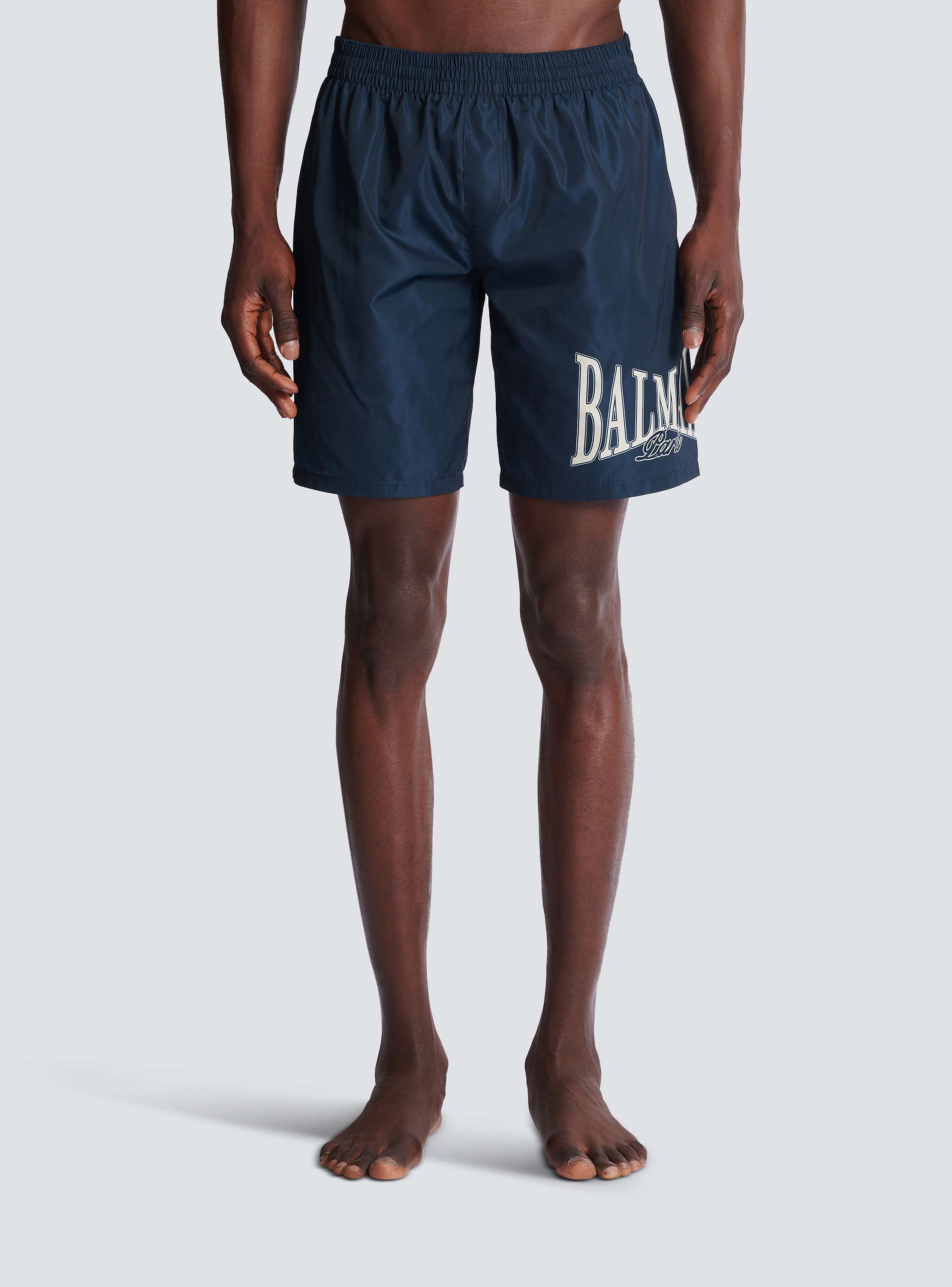 Swim shorts with Balmain College logo
