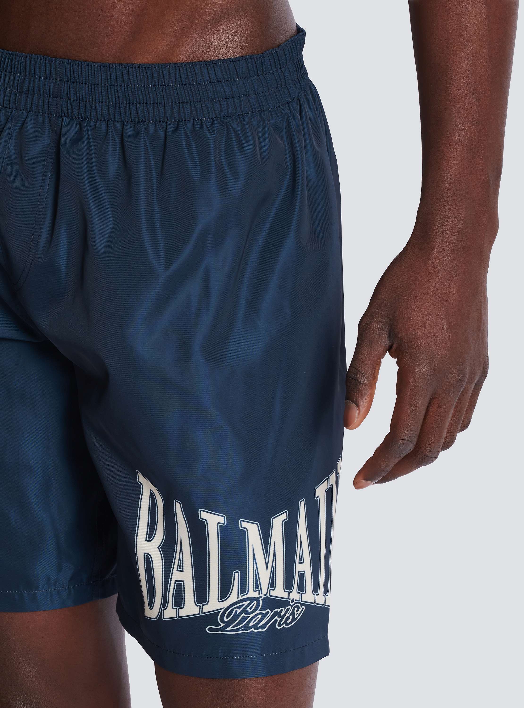 Swim shorts with Balmain College logo