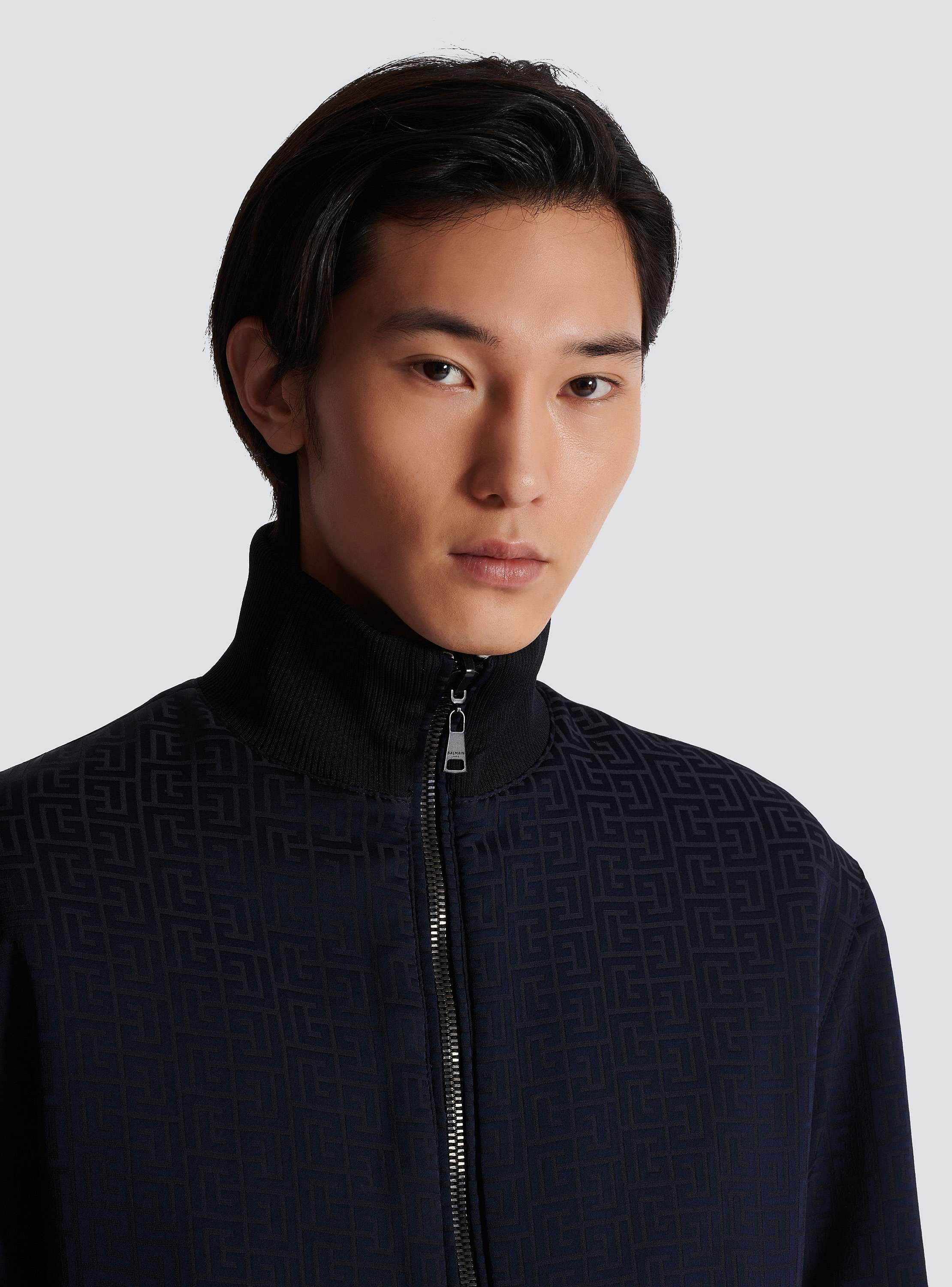 Reversible monogrammed bomber jacket