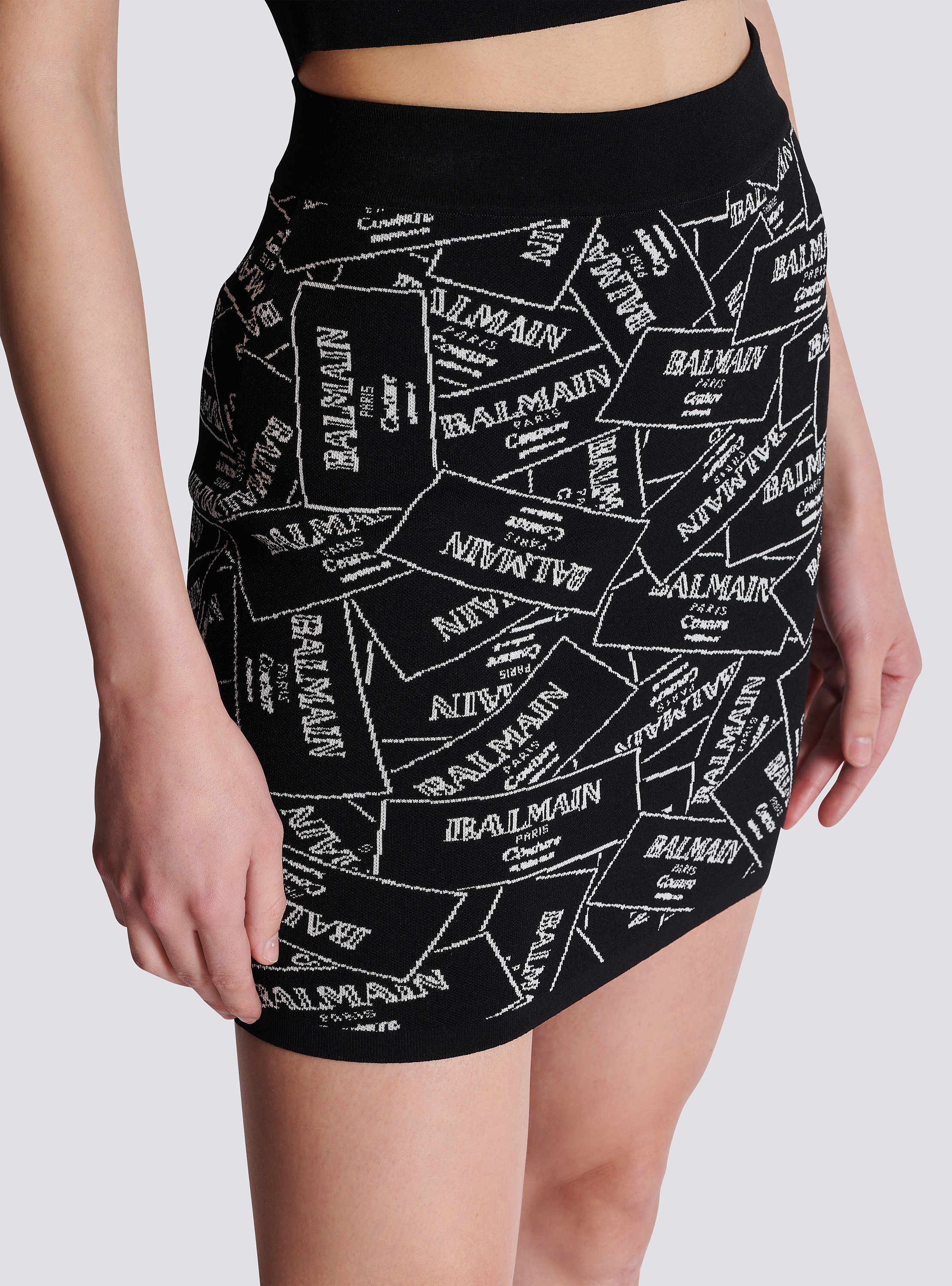 Short skirt in Balmain label jacquard knit black - Women