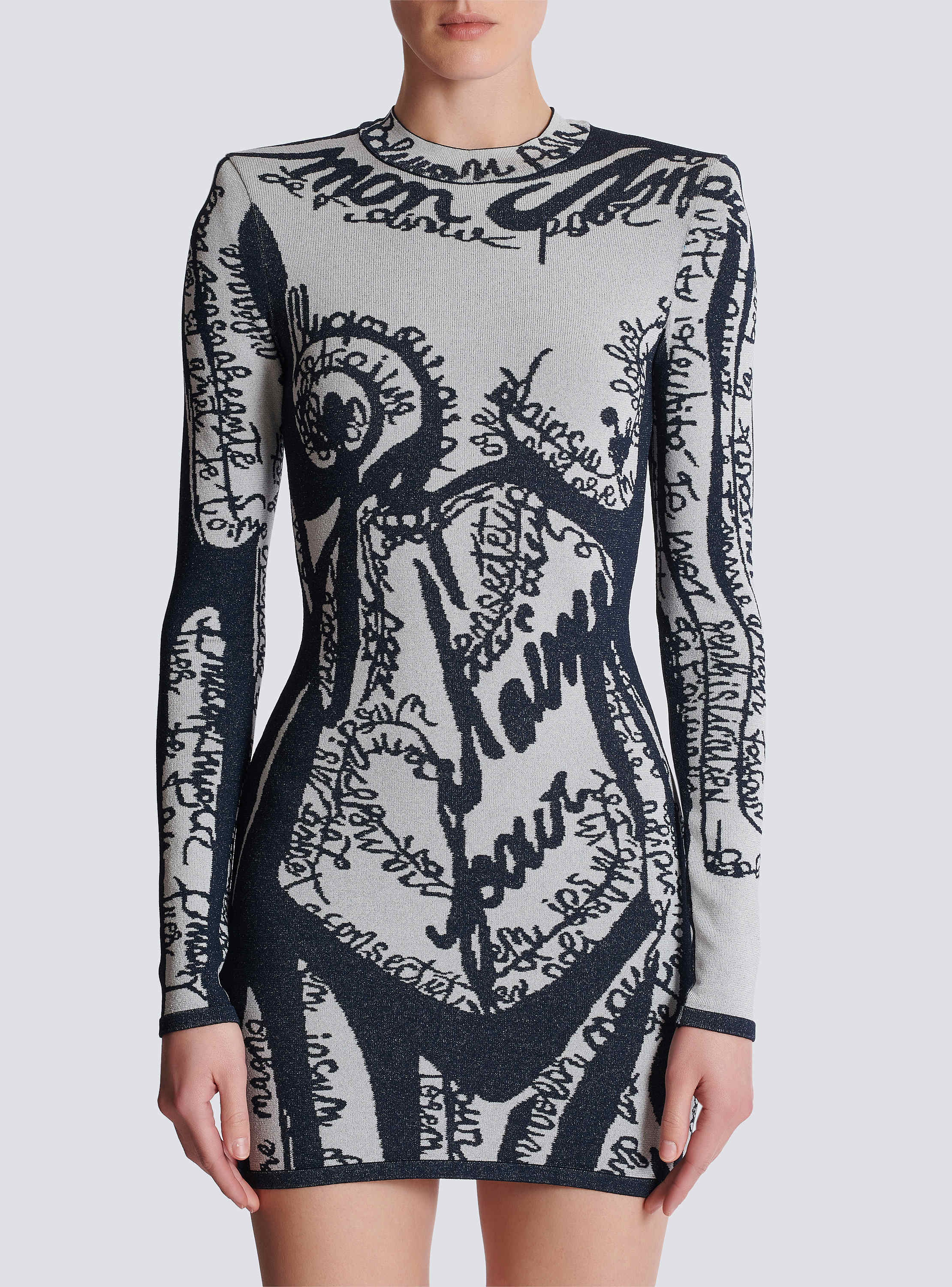 Short embroidered dress with body motif