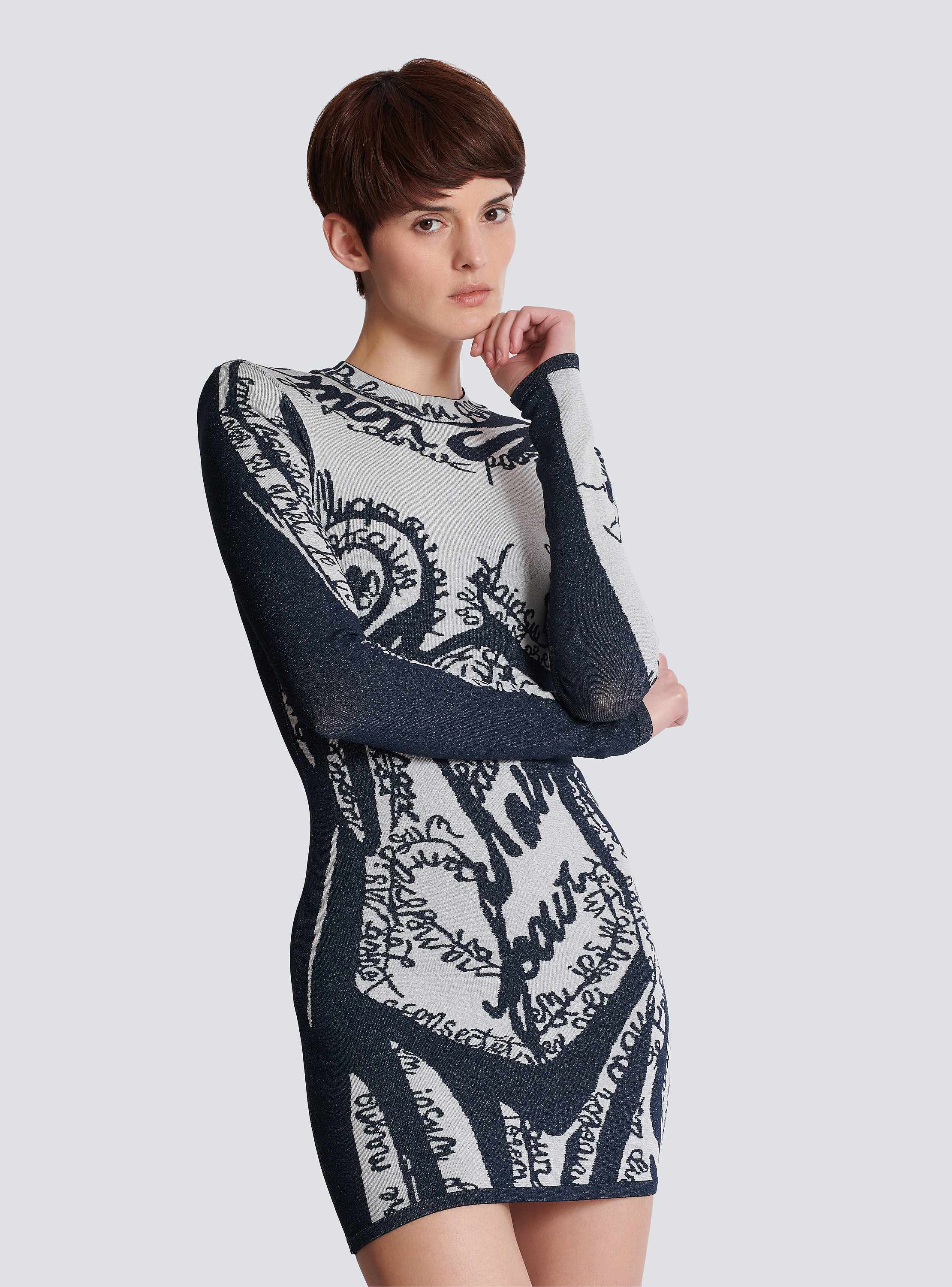 Short embroidered dress with body motif