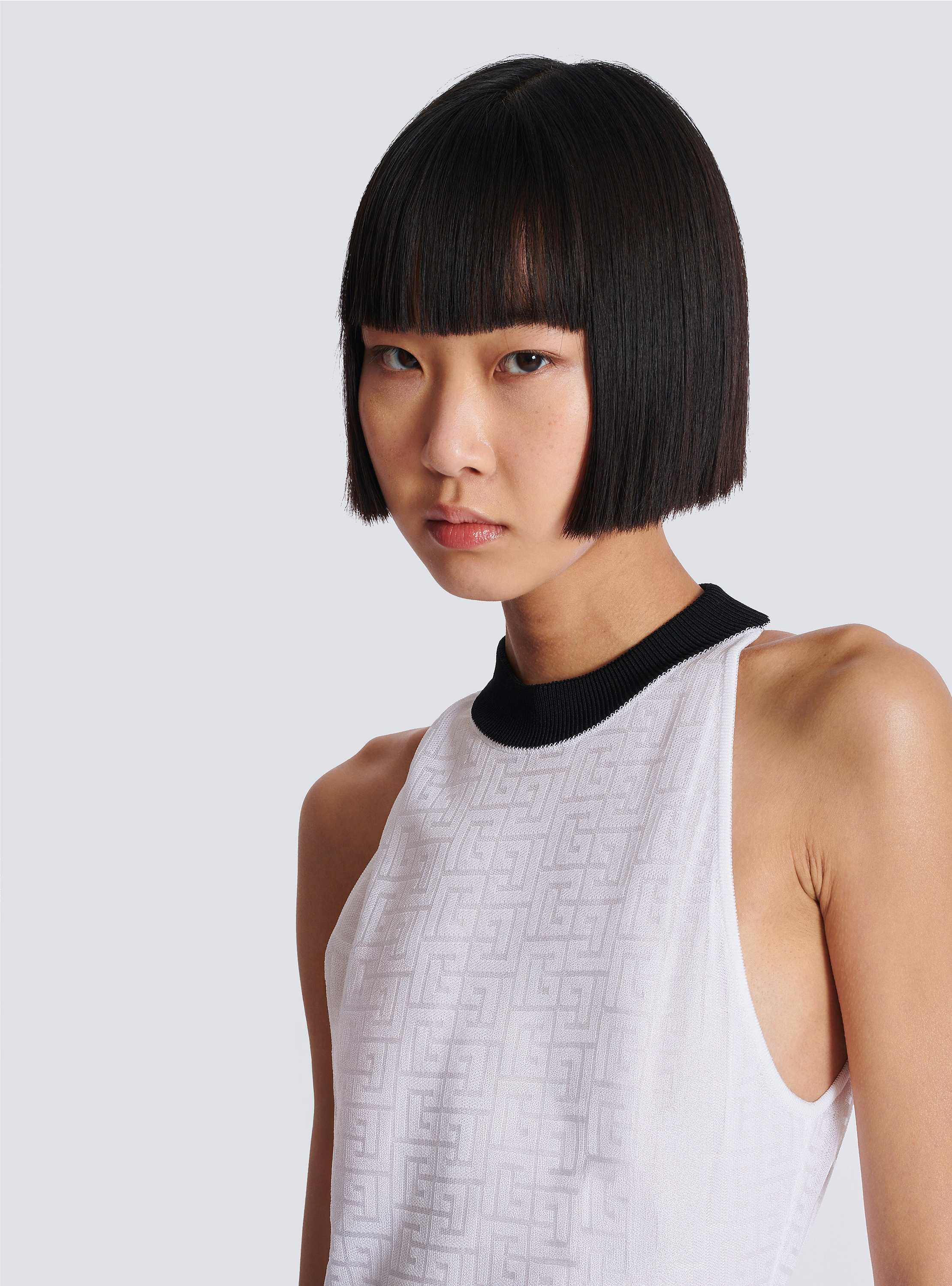 Two-tone monogrammed knit bodysuit