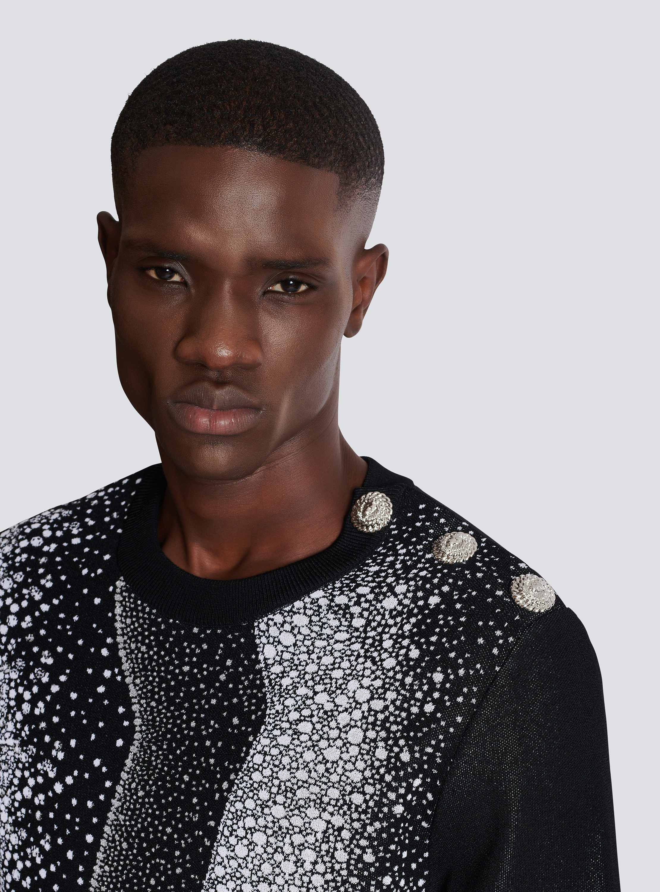 Faces jacquard buttoned knit sweater