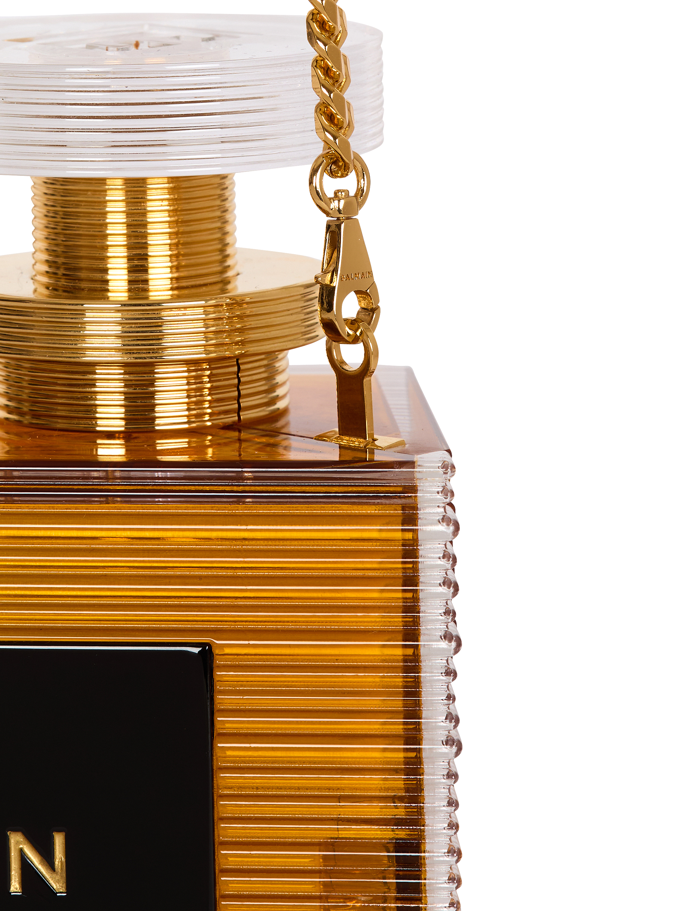 Perfume minaudière in resin and brass