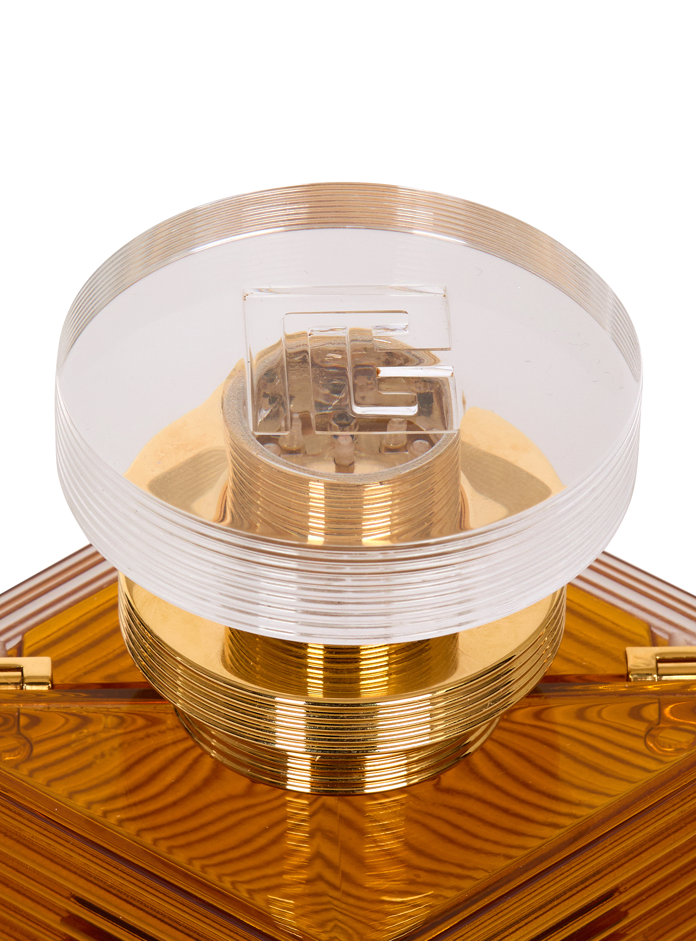 Perfume minaudière in resin and brass