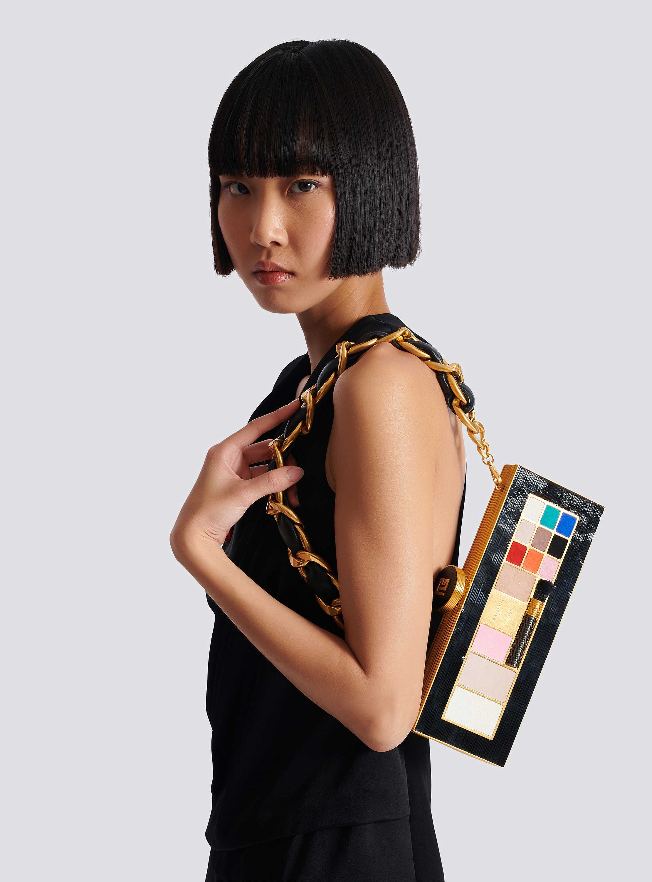 Pochette Make-up aus Messing und Leder 