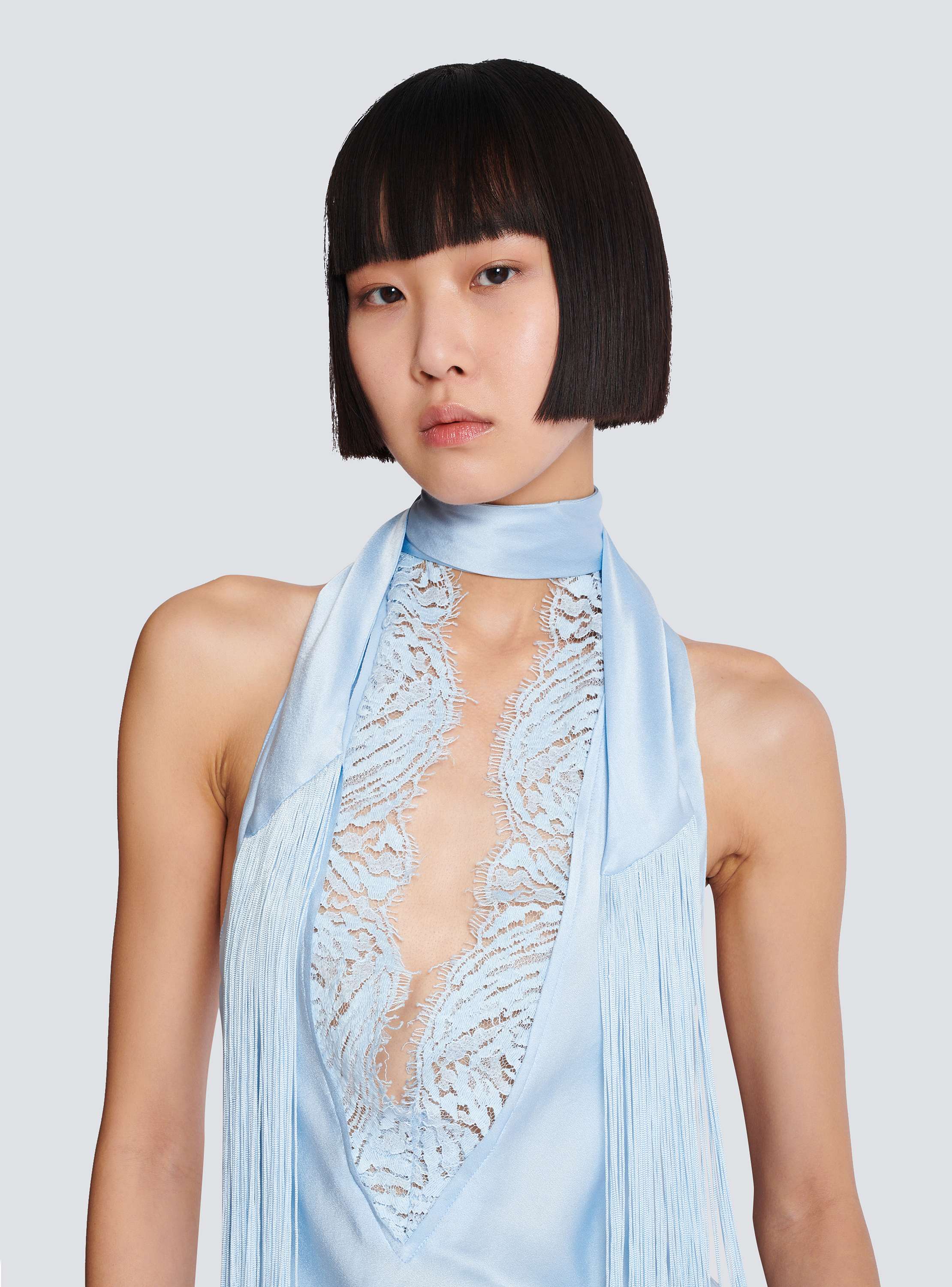 Backless fringed satin top