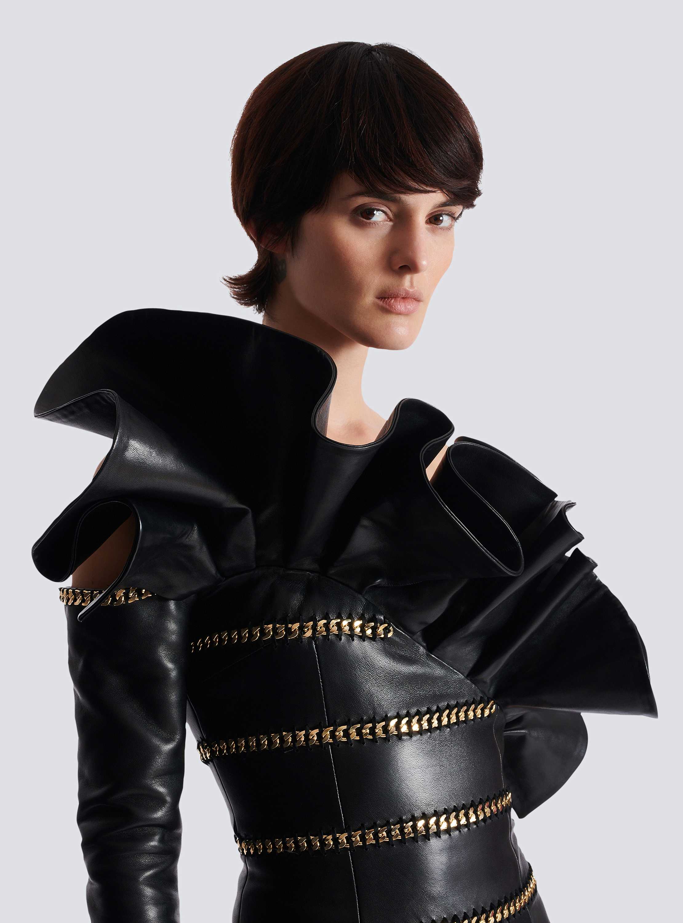 Asymmetric leather bodycon dress with chains