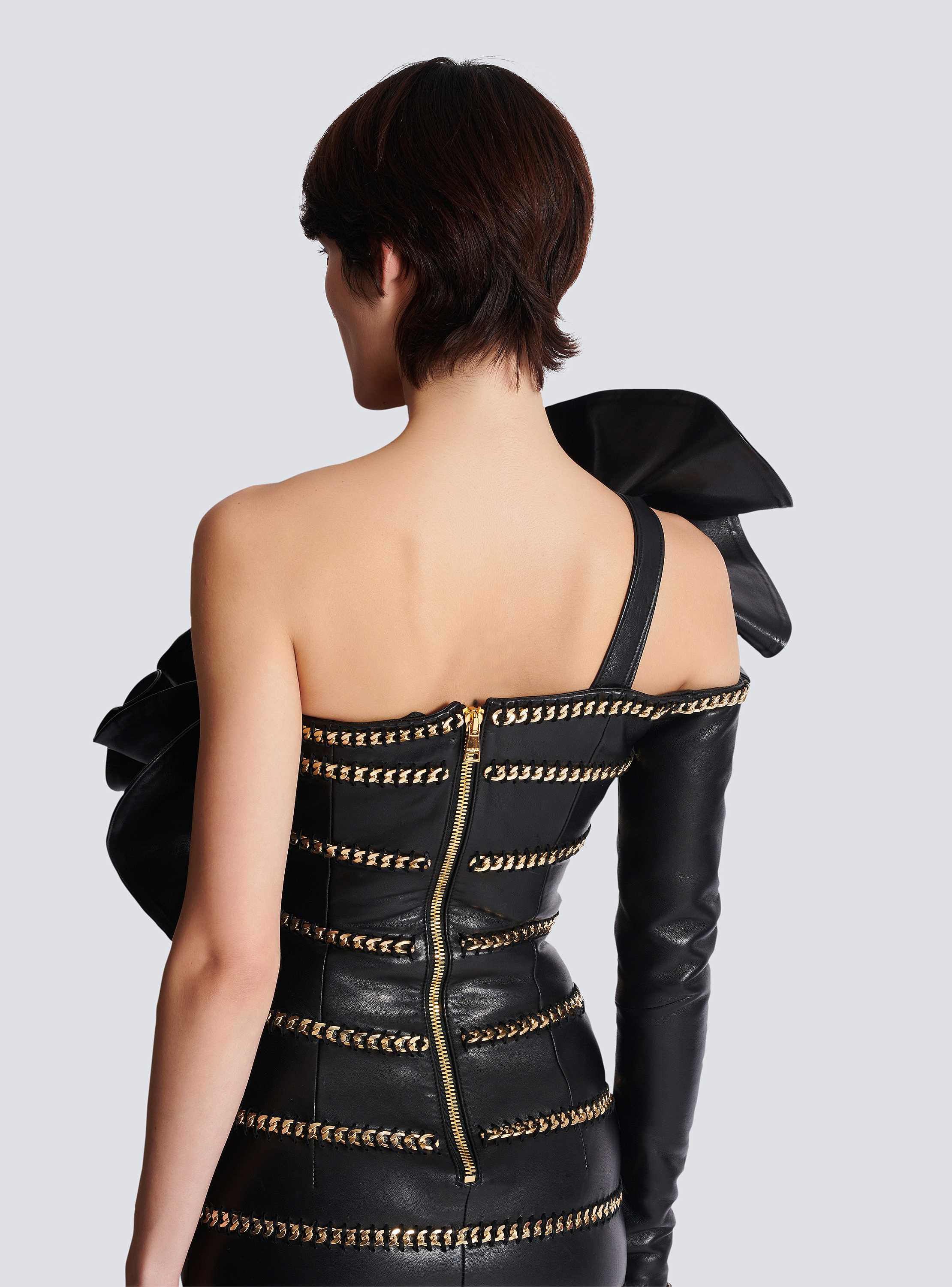 Asymmetric leather bodycon dress with chains