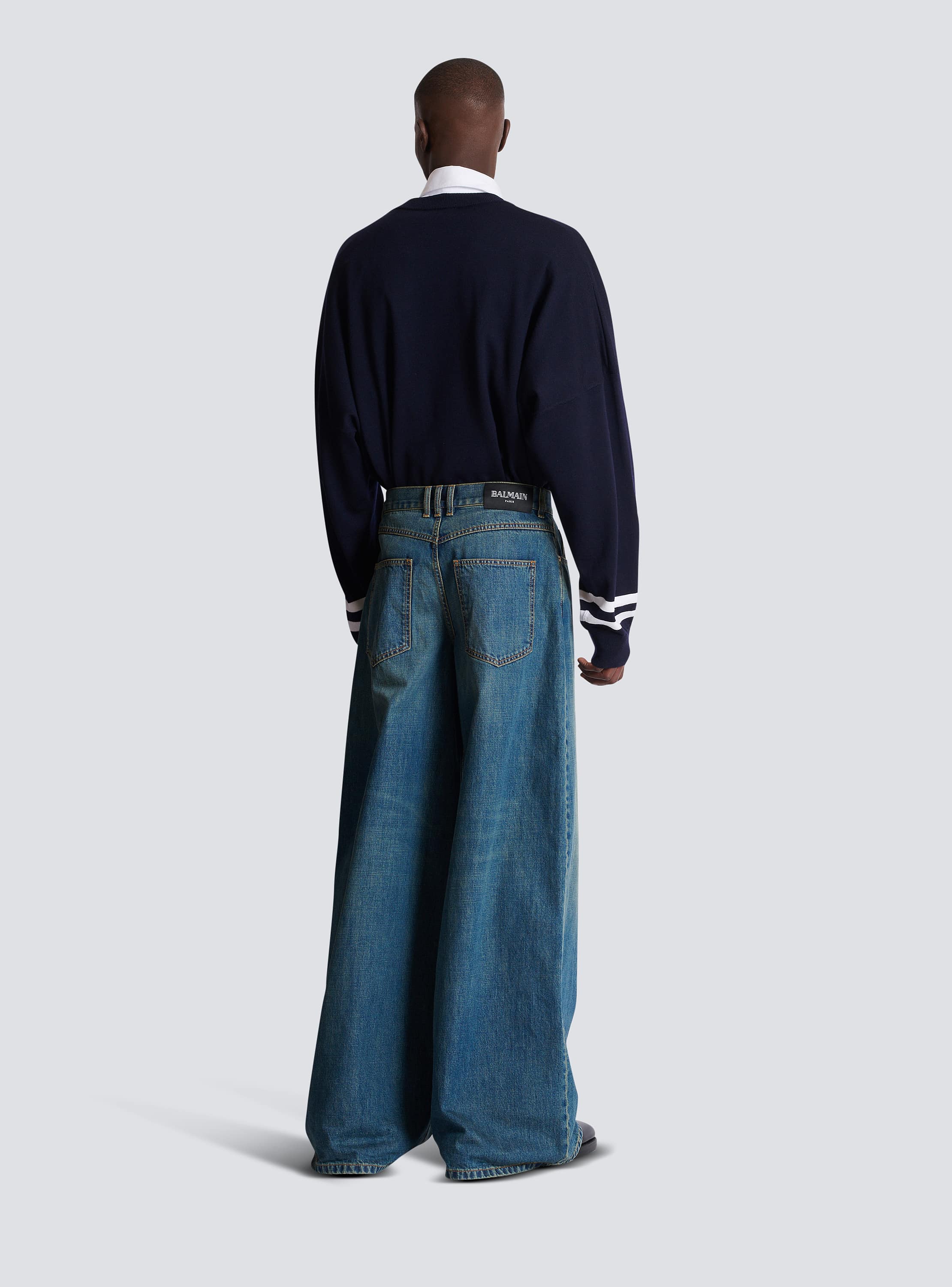 Wide-leg faded denim jeans