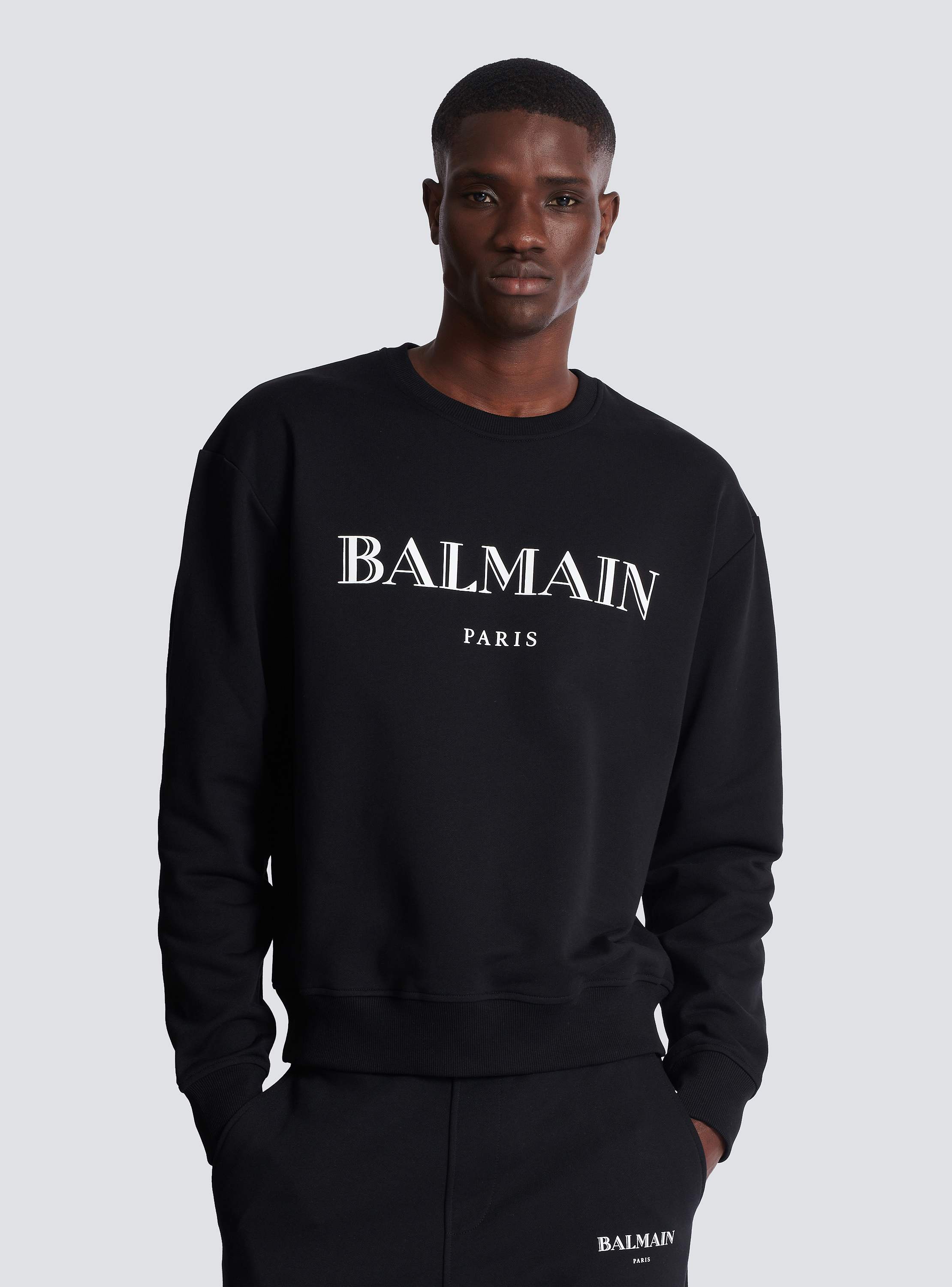 BALMAIN ロゴプリントリブヘムスウェットシャツ Balmain Parisプリント スウェットシャツ - Men | BALMAIN