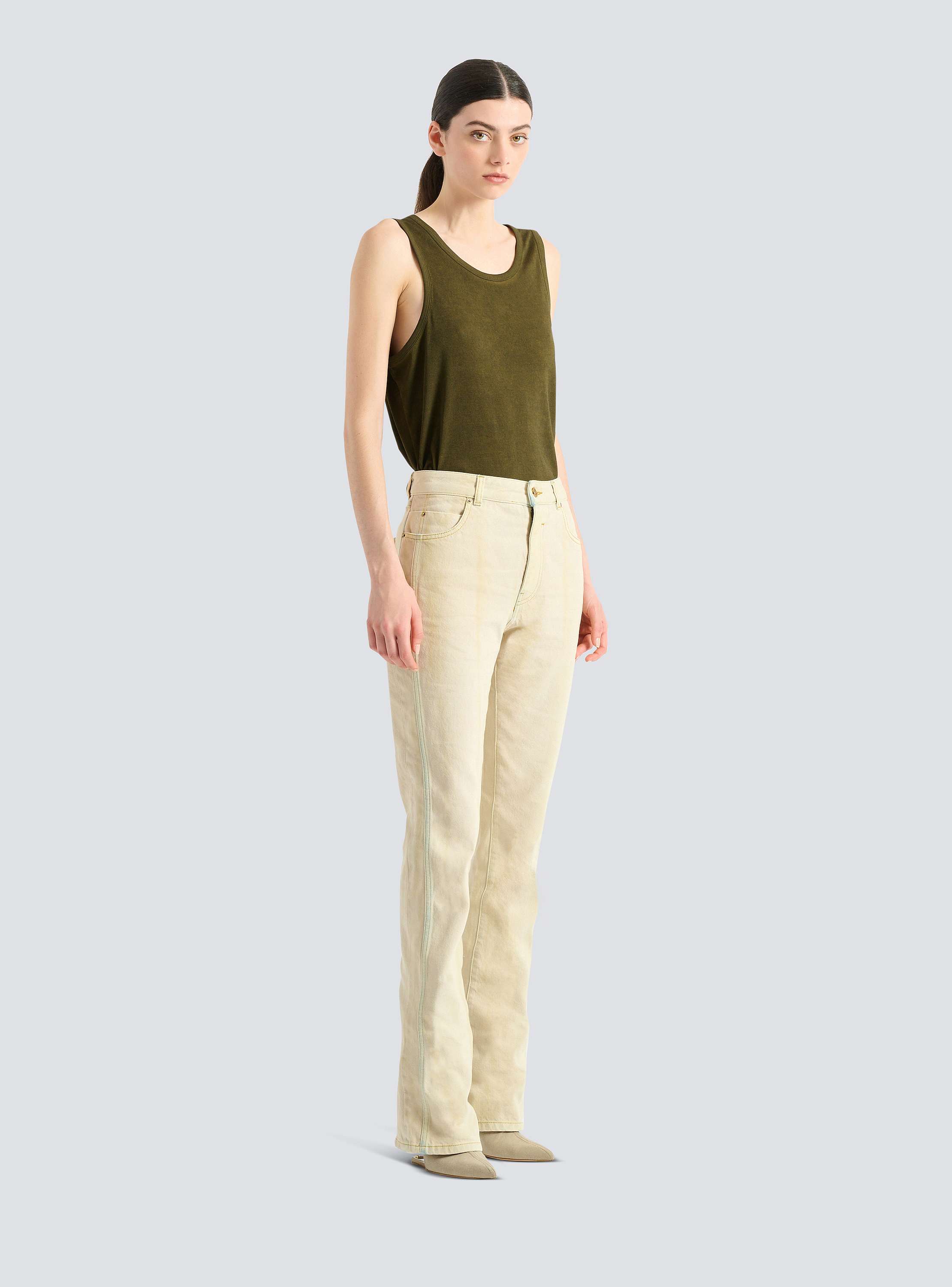 High-waisted faded denim jeans