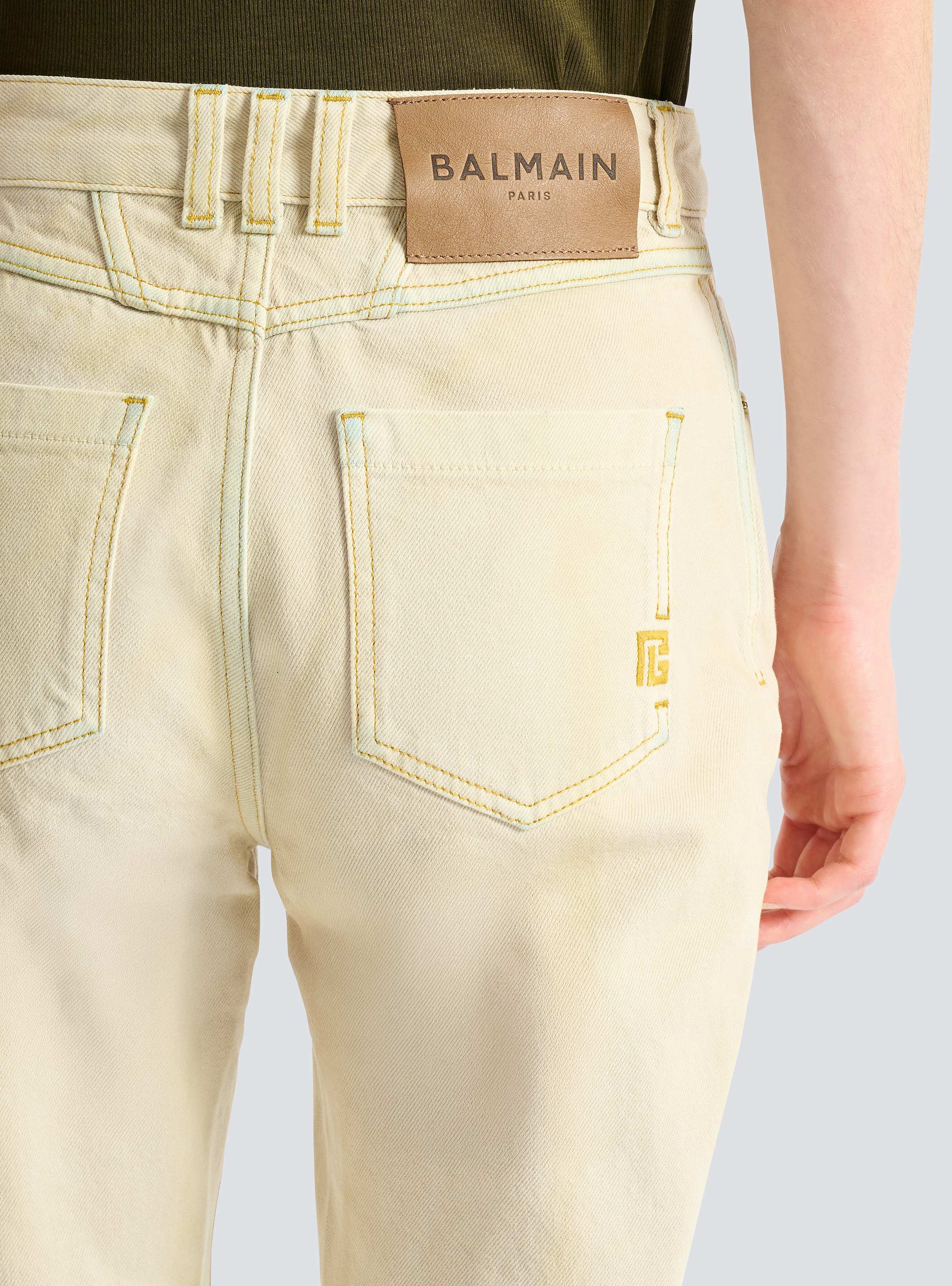 High-waisted faded denim jeans