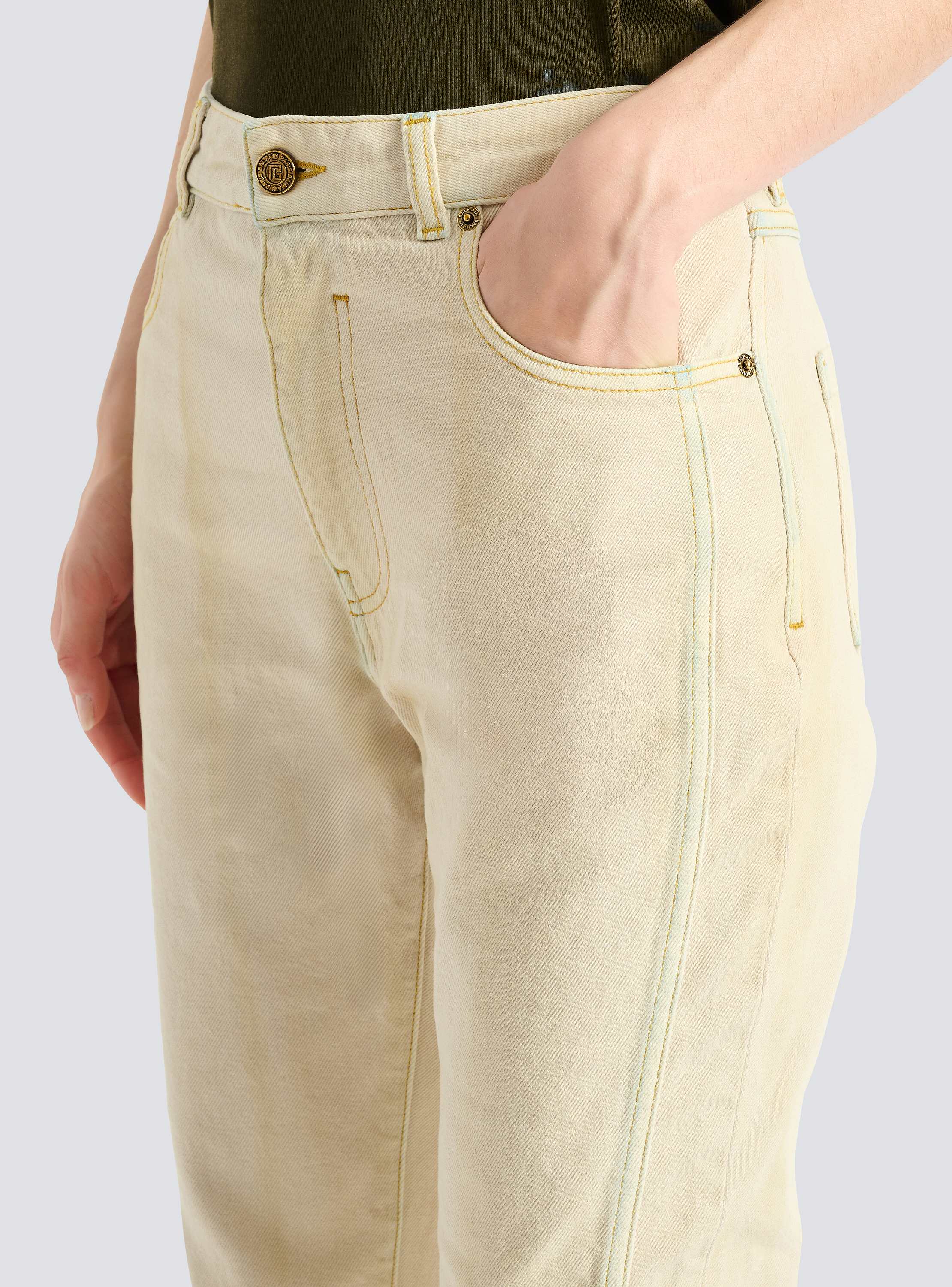 High-waisted faded denim jeans