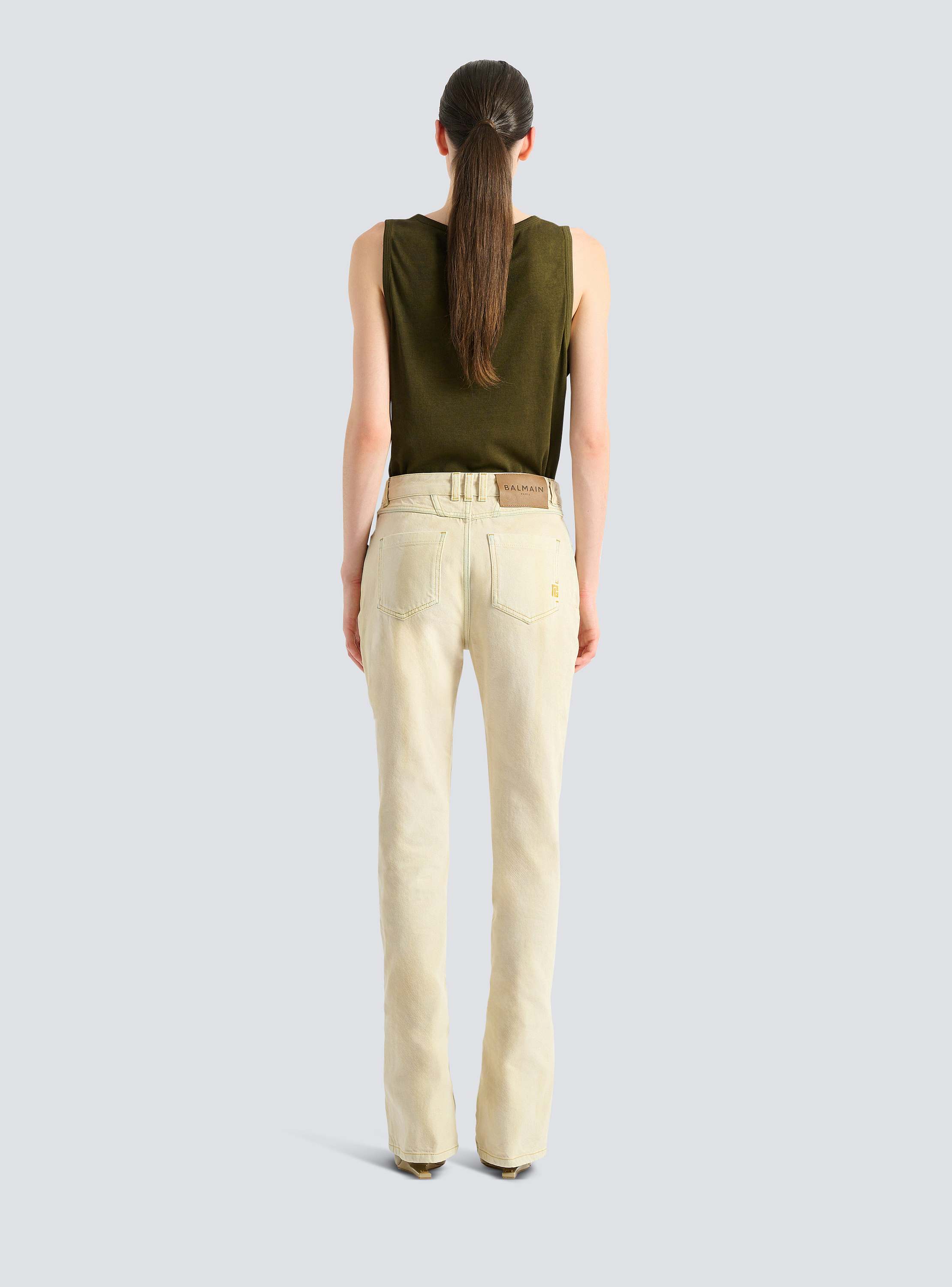 High-waisted faded denim jeans