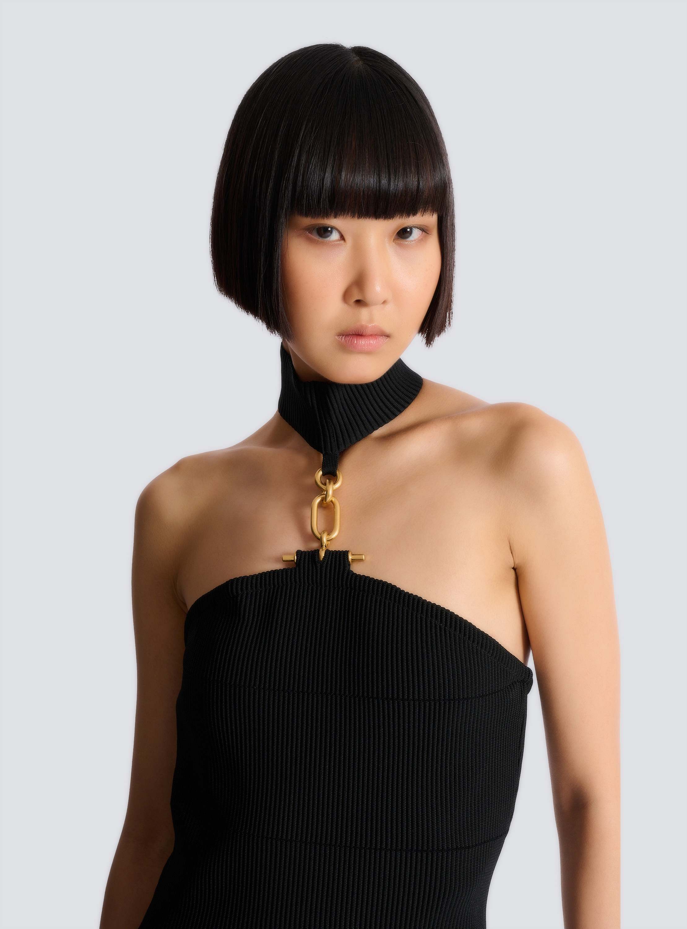 Long sleeveless dress with embellished detail