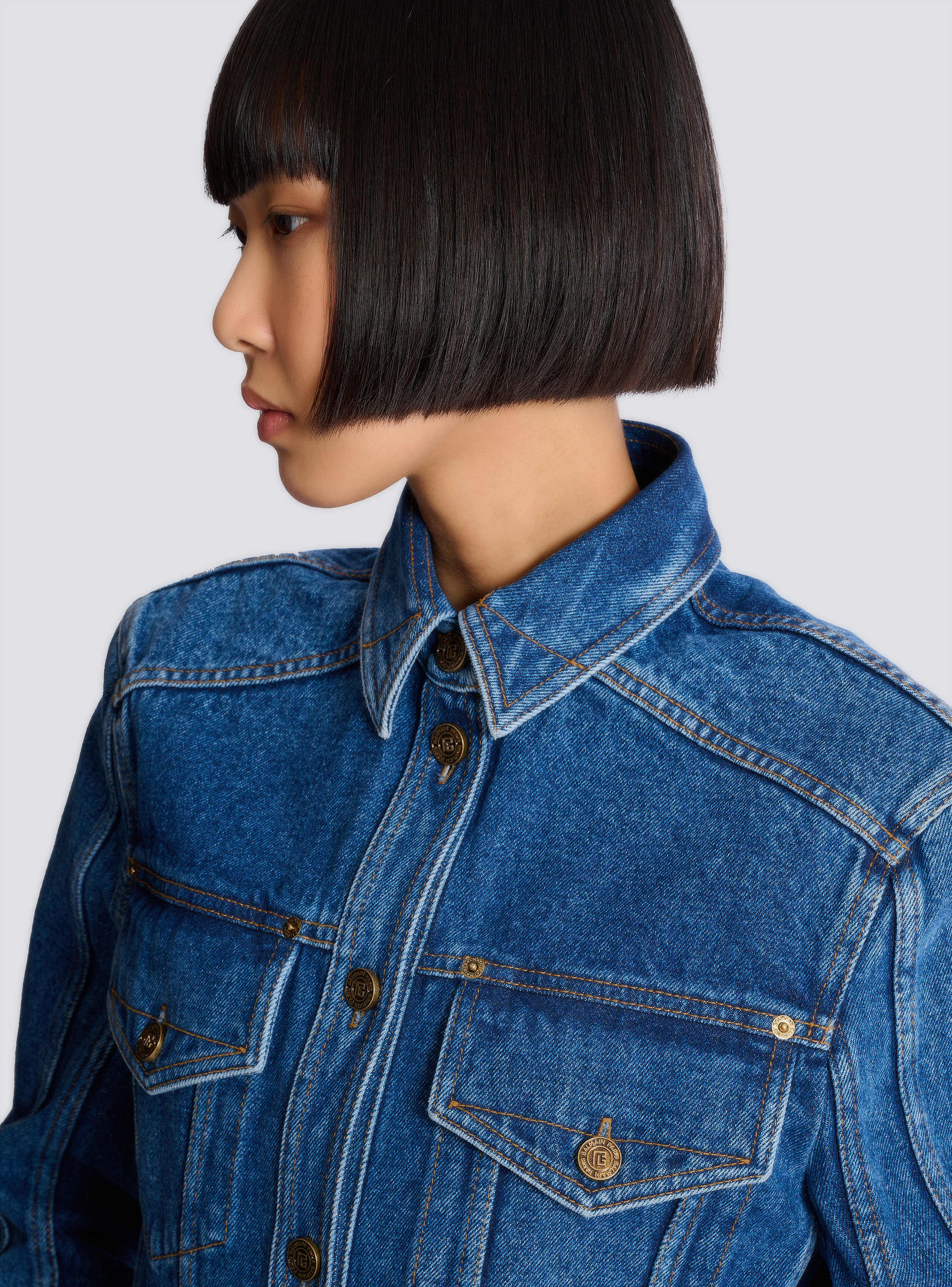 Cropped faded denim jacket