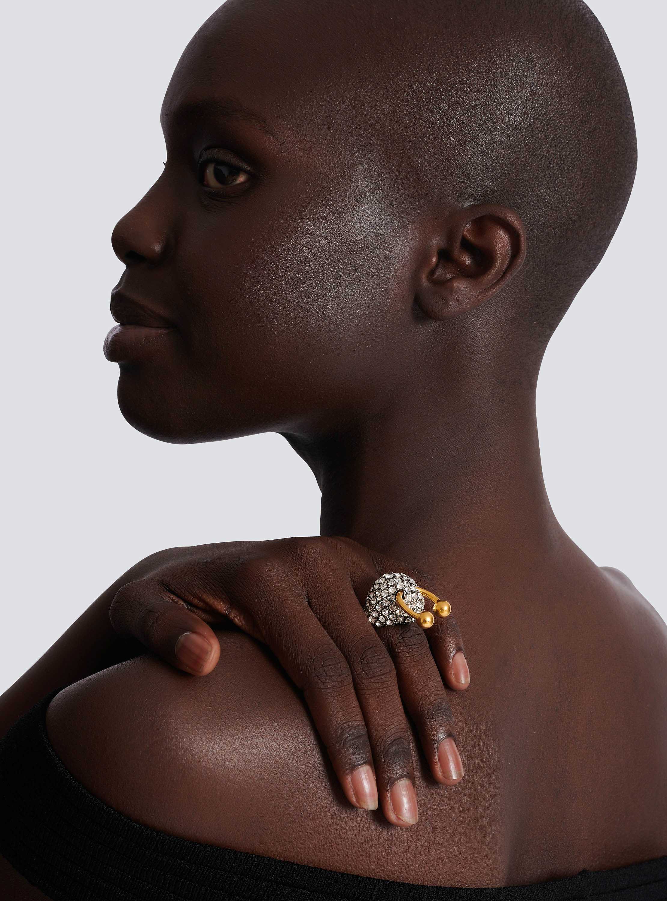 Piercing brass and rhinestone ring