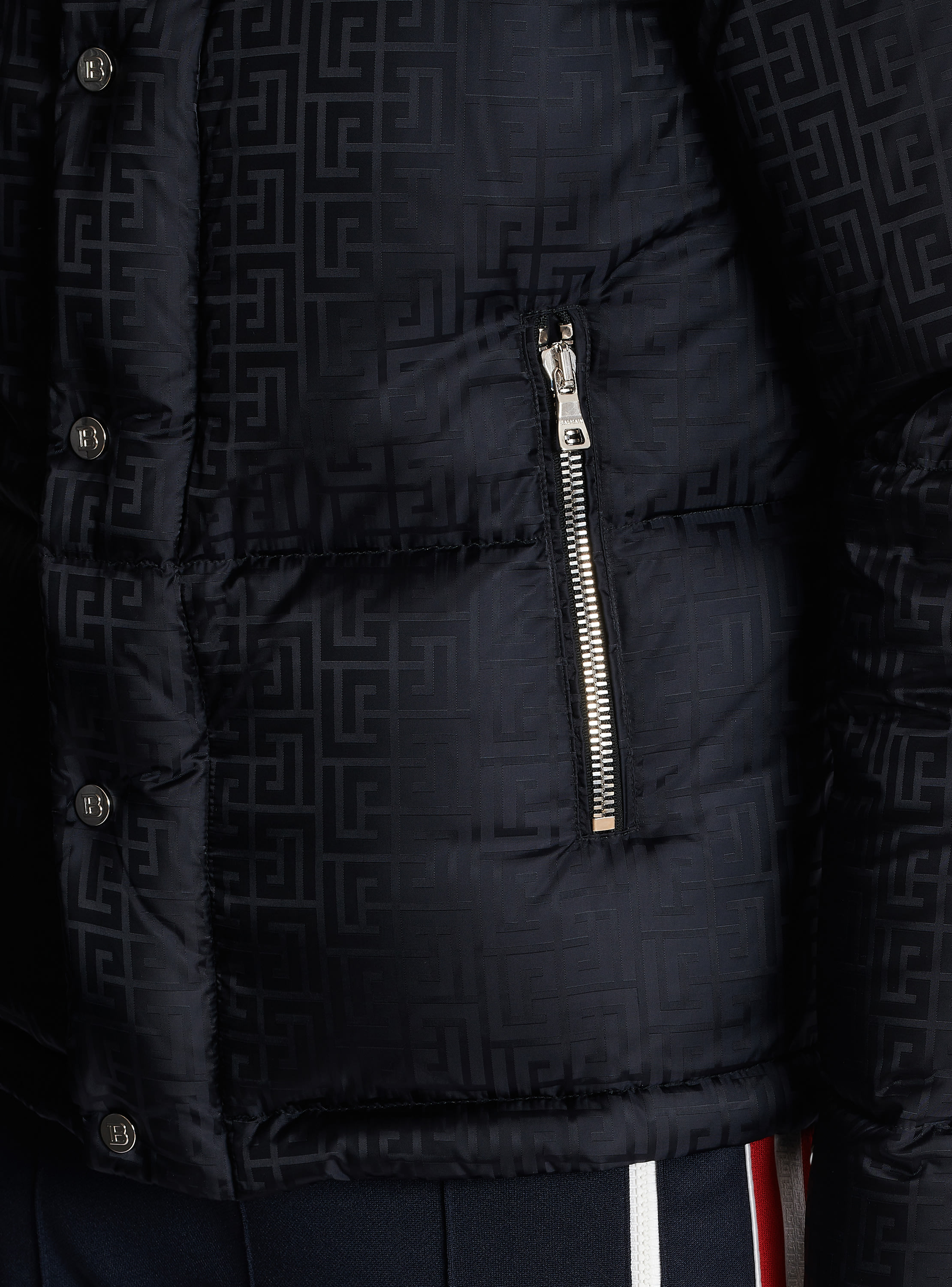 Balmain monogram-pattern padded sleeveless jacket worn by Cane