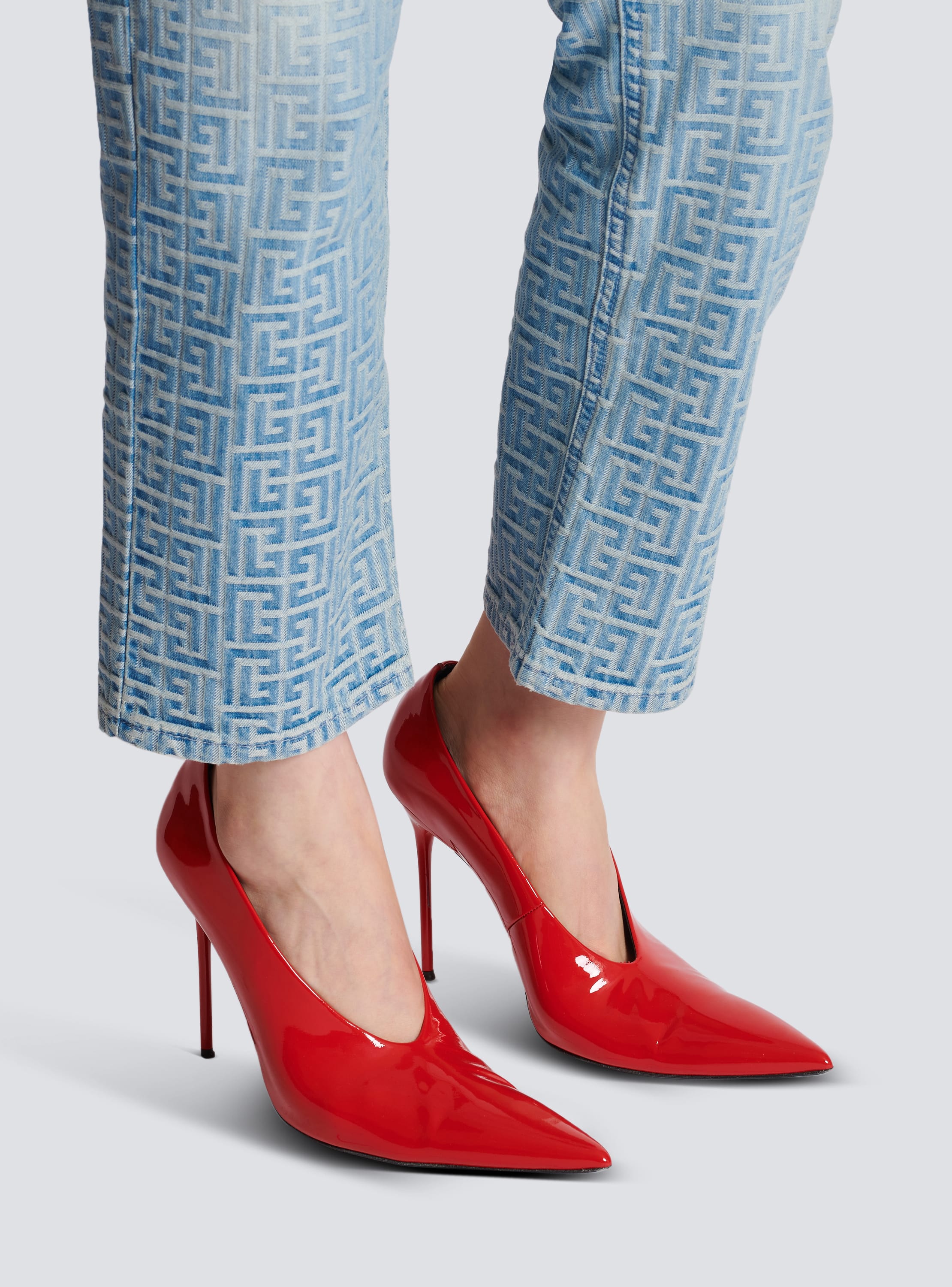 Red store patent pumps