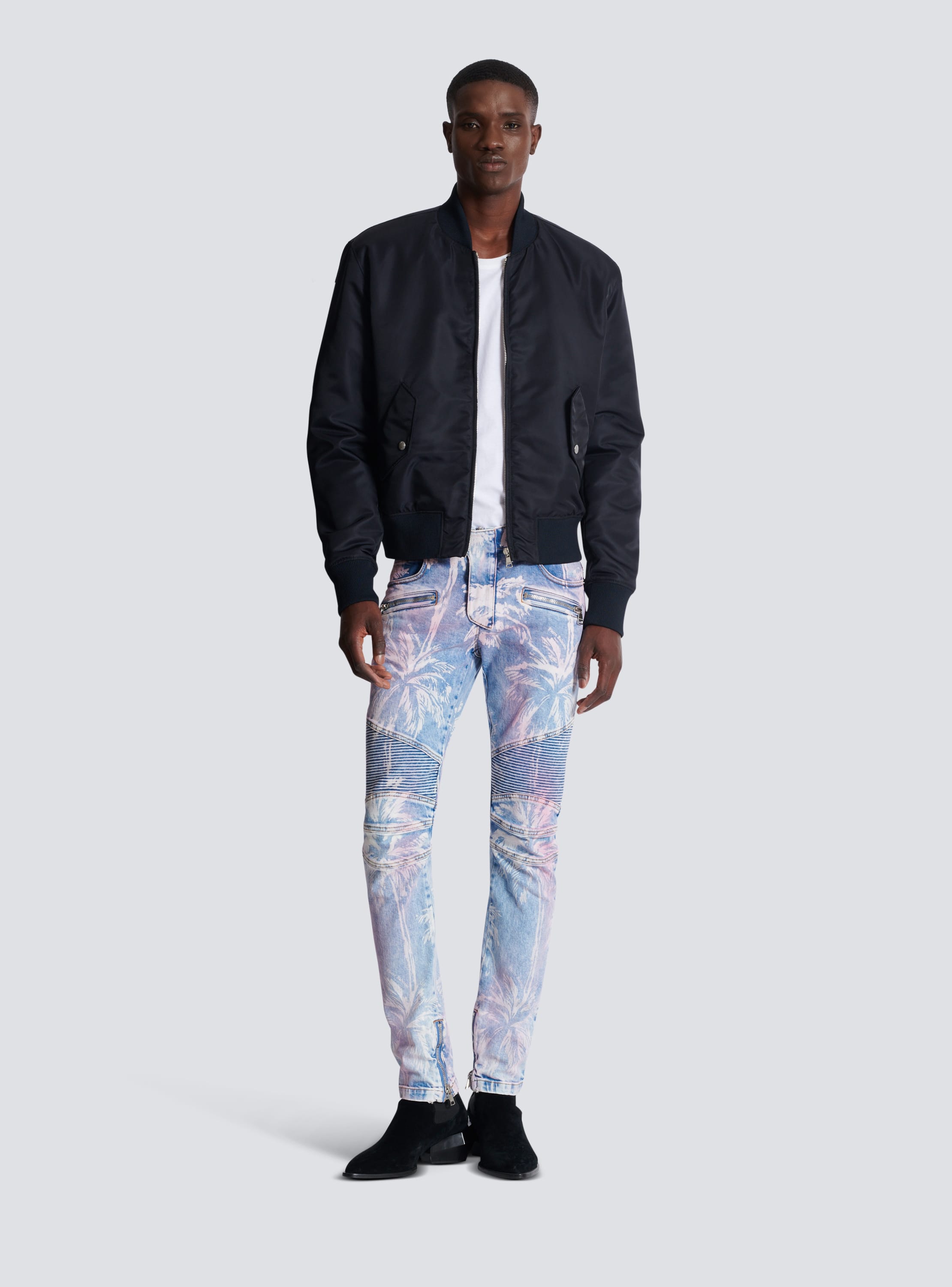 Denim biker jeans with a palm tree print