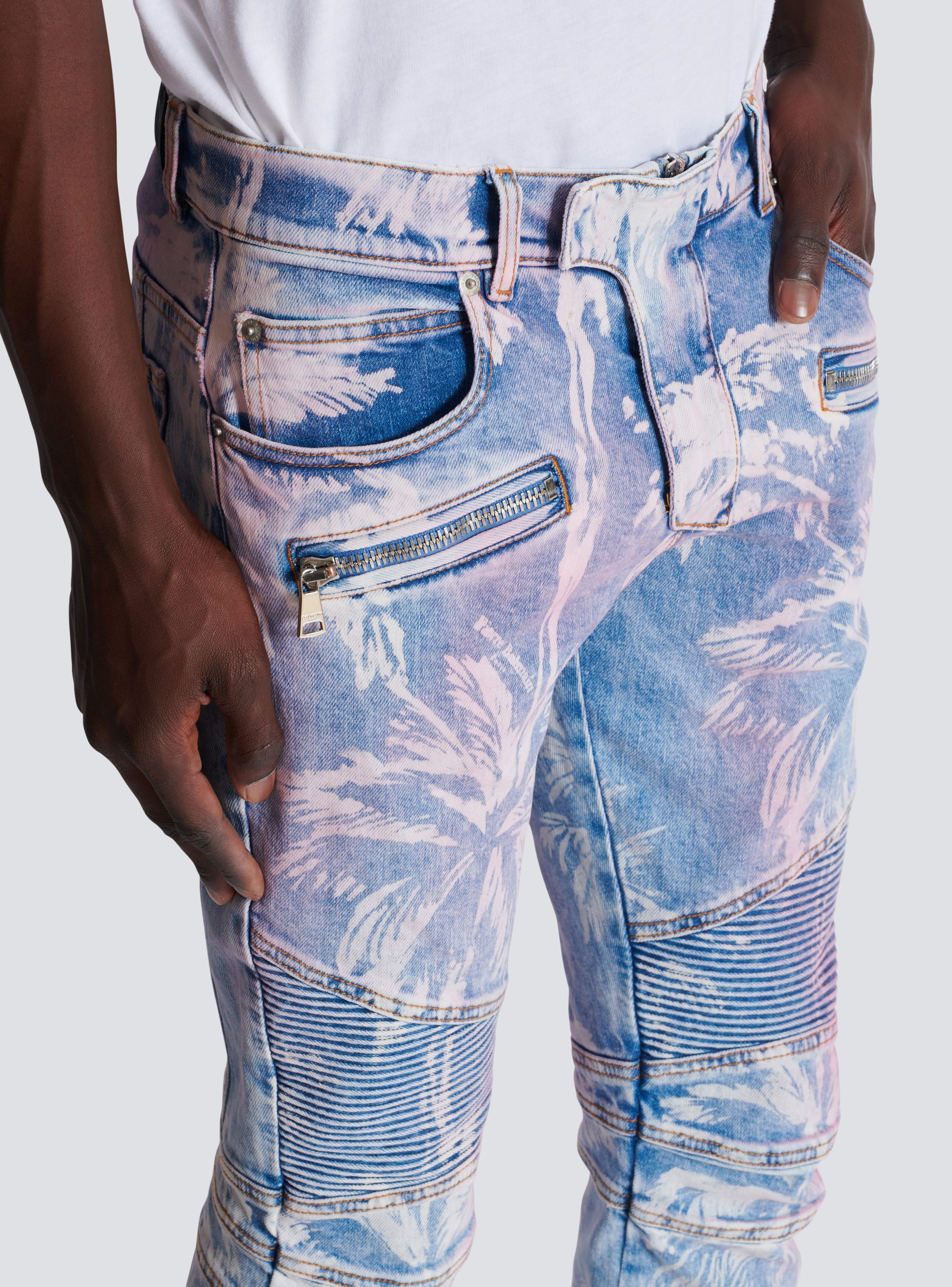 Denim biker jeans with a palm tree print