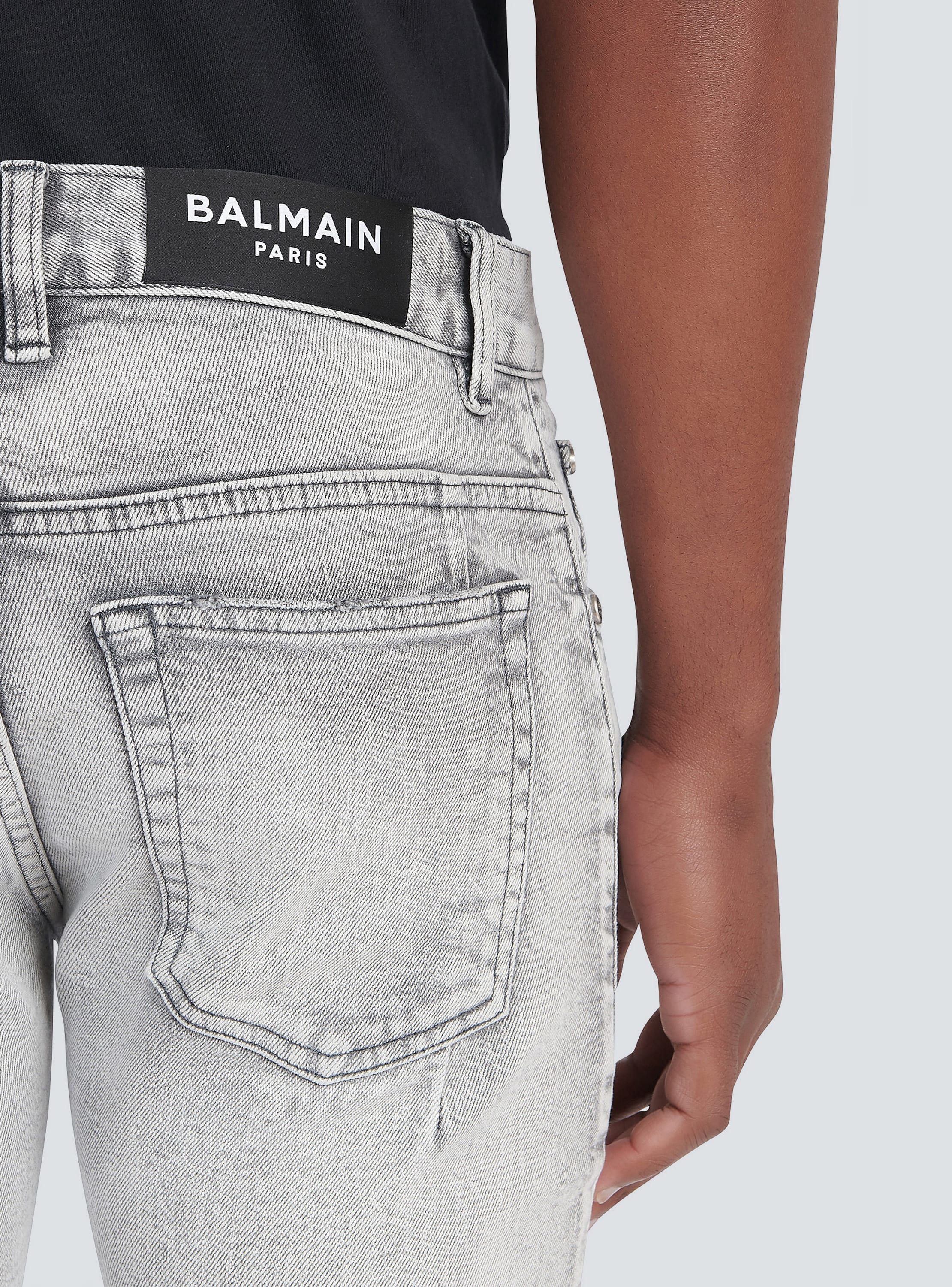 Slim cut ripped cotton jeans with synthetic leather panels